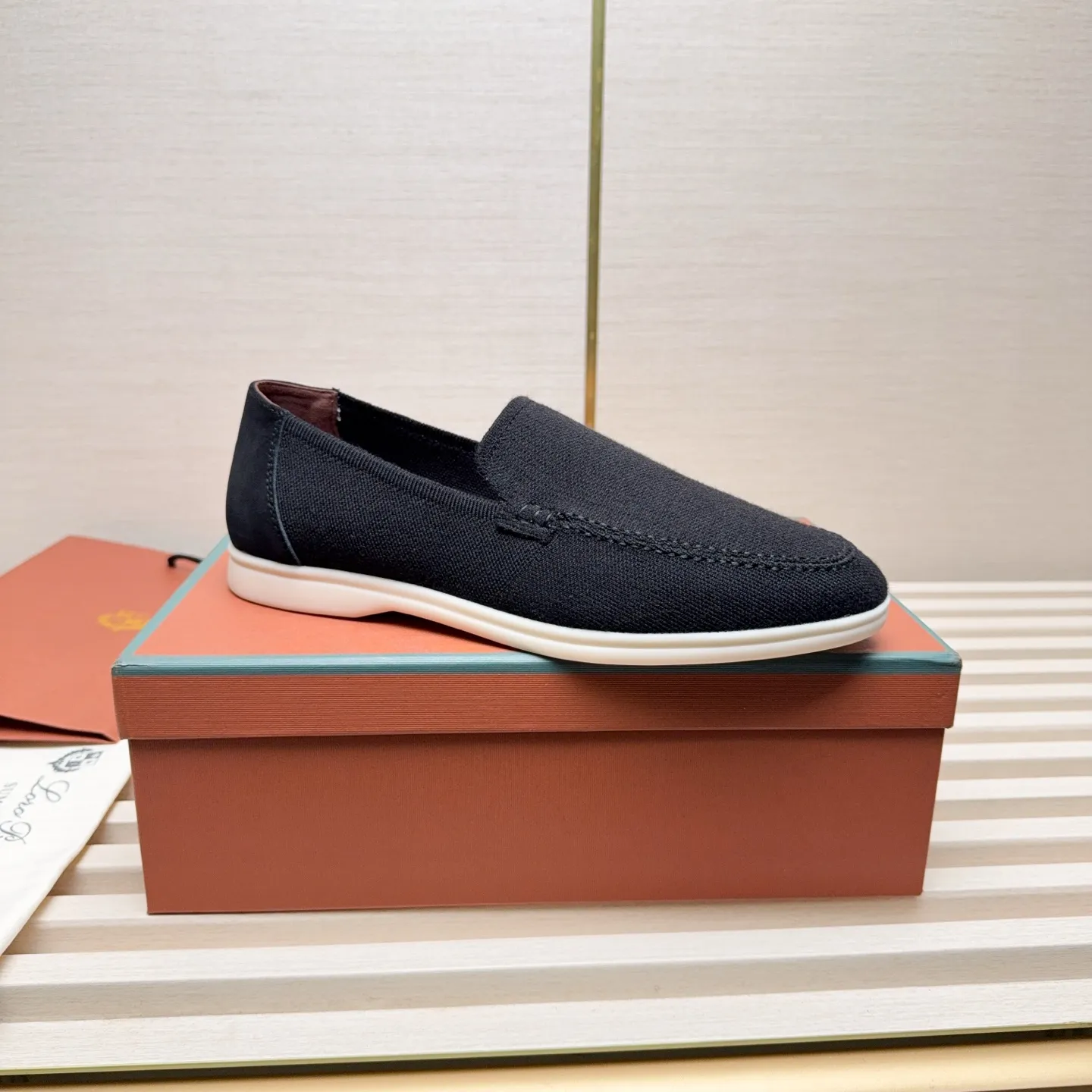 Men's Men's Shoes 💰400 Loro PIana moccasins are made of wish wool fabric. The upper is made of knitted fabric, made on a loom, and then attached to a rubber sole. The Rain System's water-repellent treatment enhances the shoe's functional design, while the suede details give the shoe a sense of elegance and sophistication. Made from Wish, fine wool from Australian and New Zealand Merino sheep